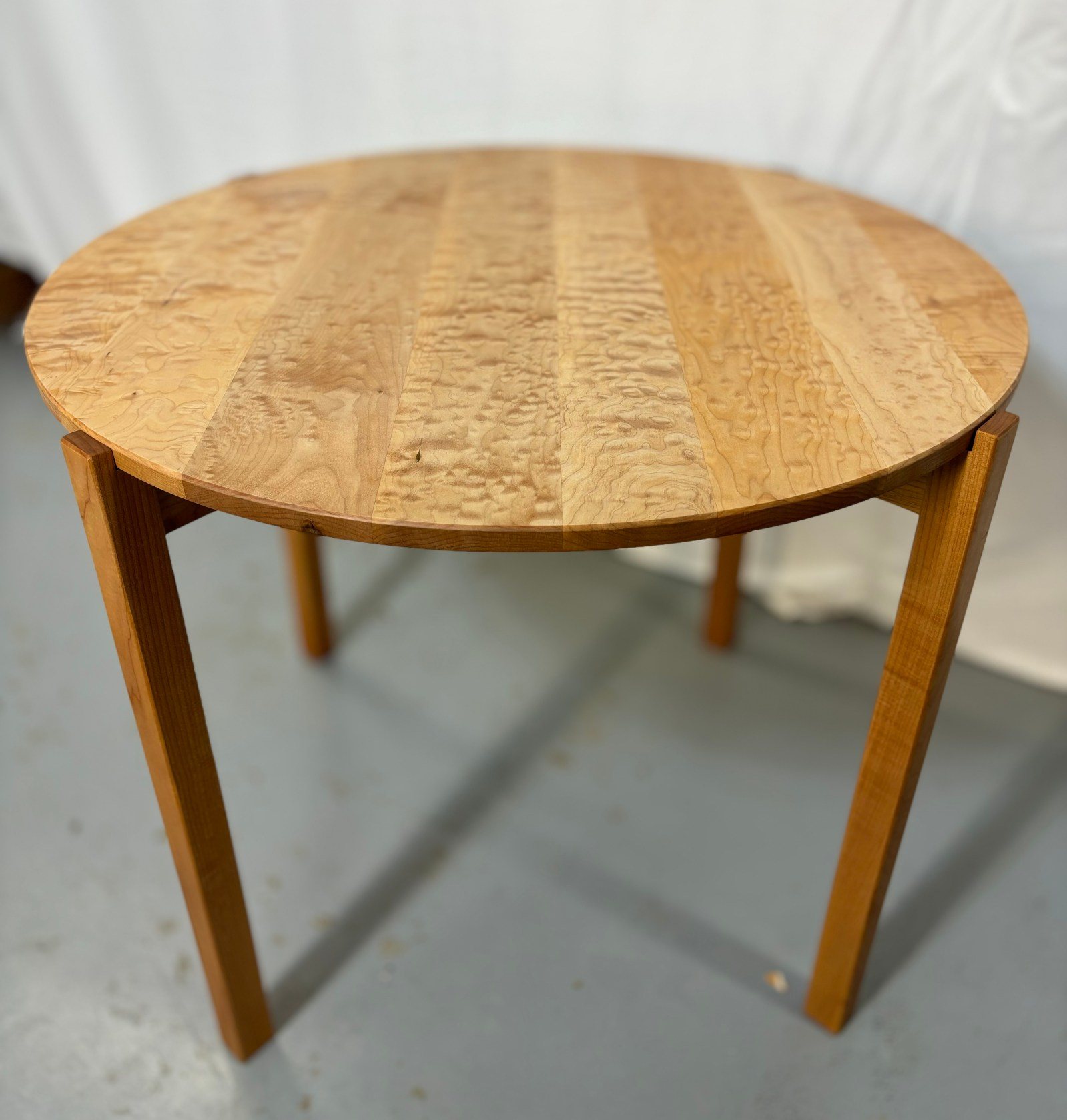 Round side table with figured maple top by PDX Woodworks
